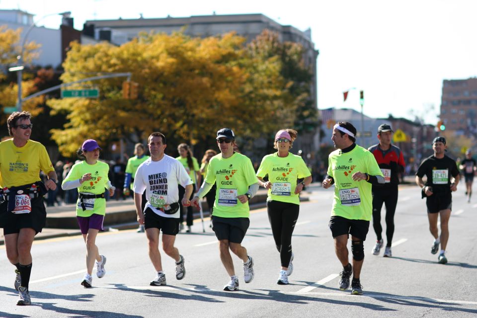 Mike and team of Achilles guides running through Brooklyn photo