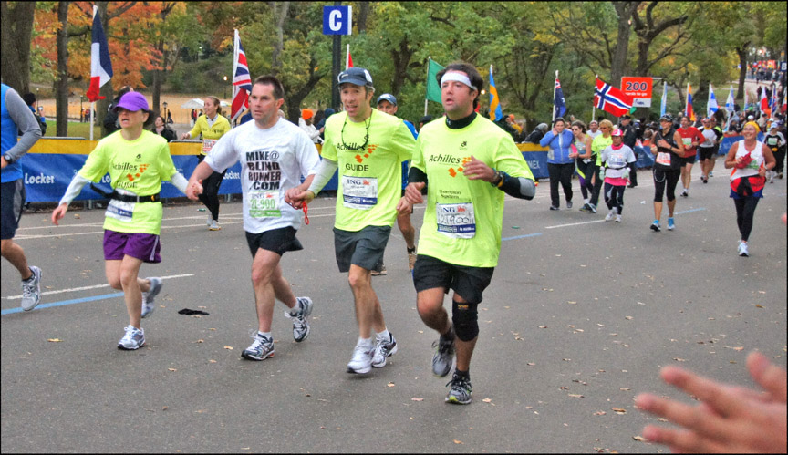 Mike and team of Achilles guides approaching the  finish of the 2011 ING New York City Marathon. Photo provided by Lawrence White